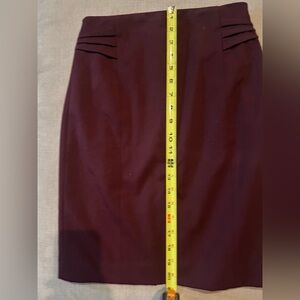 Flattering fitted pencil skirt -full lined w/ back slit & zipped back closure.